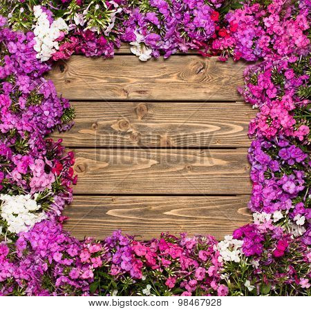 Lilac flowers on wooden background