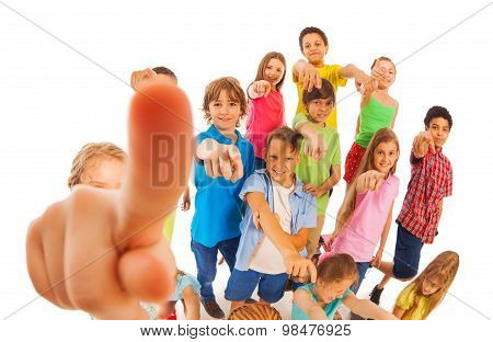 Funny group of kids pointing fingers