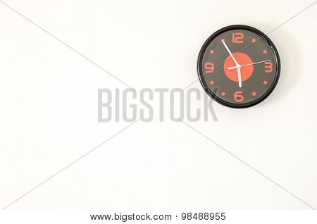 Black Modern Wall Clock On White Concrete Wall With Palce For Text