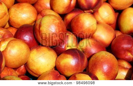 Ripe Nectarines Background For Sale At Vegetable Market