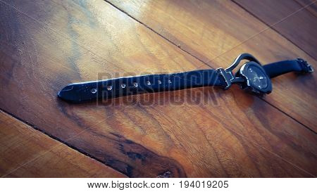 stylish lades hand watch in box on dark shed wood background
