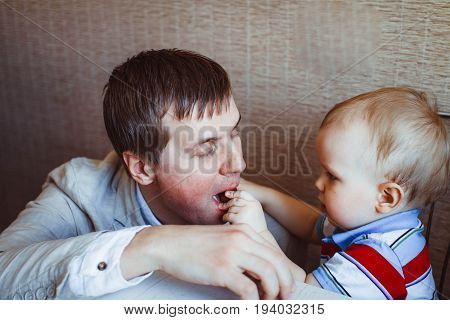 baby reaching shiny foil wrapped hard candy