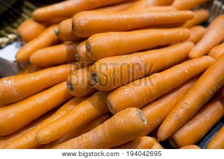 Fresh carrots washed in the market. background
