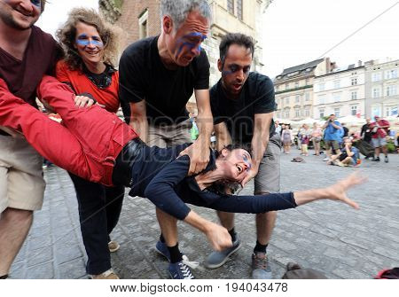 CRACOW POLAND - JULY 5 2017: 30th Street - International Festival of Street Theaters in Cracow Poland. An Odyssey Towards New Shores - a street parade