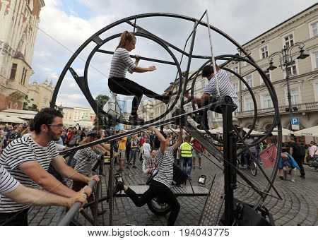 CRACOW POLAND - JULY 5 2017: 30th Street - International Festival of Street Theaters in Cracow Poland. An Odyssey Towards New Shores - a street parade