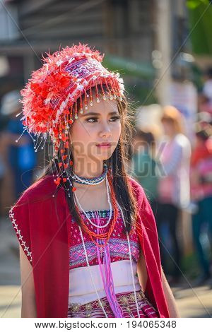 CHIANGMAI THAILAND - JANUARY 25 2015: Hill tribe girl with local traditional costume in parade of 22nd Traditional Skirt Fabric and The Indigenous Product and Culture Festival in Mae Chaem Chiangmai Thailand