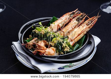 Royal prawns served with herbs and quinoa.