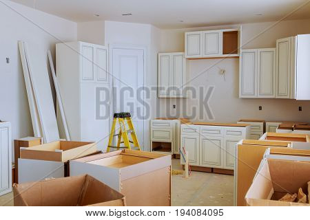 Custom Kitchen Cabinets In Various Stages Of Installation