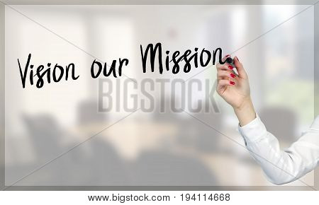 Women hand writing Vision our Mission with black marker on transparent screen
