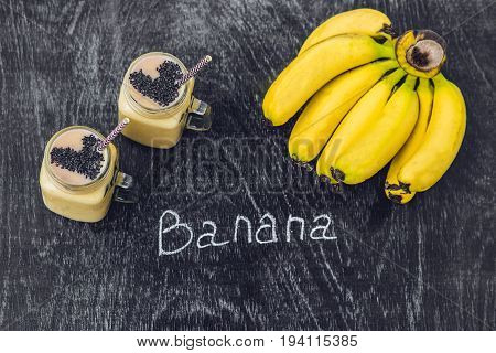 Banana Smoothies And Bananas On An Old Wooden Background