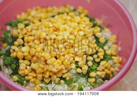 Fresh salad with canned corn cabbage and parsle