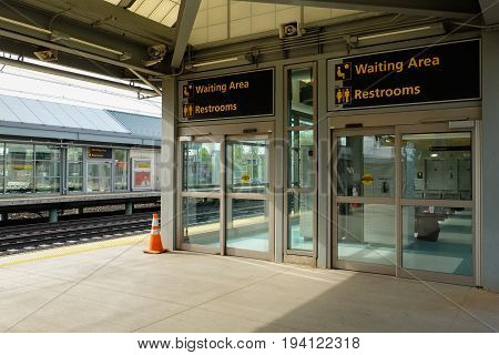 NEWARK, NEW JERSEY, USA - APRIL 25, 2016: Waiting area at a platform of Newark Liberty International Airport train station