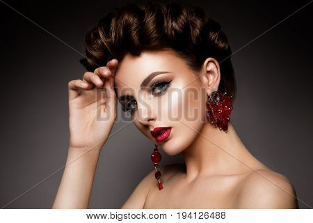 Beauty woman with blue eyes and red lips. Shine skin. Cosmetics.