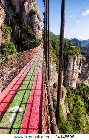 The suspension bridge at Fangdong Scenic Area in Yandangshan mountains located in Zhejiang province China.
