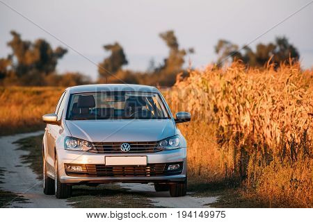Gomel Belarus - September 14, 2016: Volkswagen Polo Vento Car Sedan Parking Near Country Road In Autumn Field In Sunny Evening.