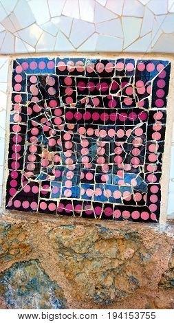 Cracked ceramic tile set in a mortar wall