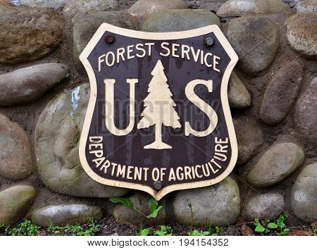 BAY MILLS TOWNSHIP MI - MAY 28: A Forest Service sign in Bay Mills Township MI is shown on May 28 2017. Bayview campground is part of Hiawatha National Forest.