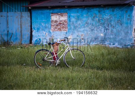 Cluj-Napoca, Romania - 27 June 2017: Unidentified child carrying a bicycle in the isolated poor romani community of Pata Rat, the rubbish dump near Cluj-Napoca, Romania