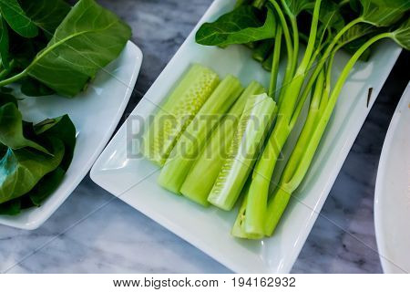 Close up Green vegetables on a white plate.