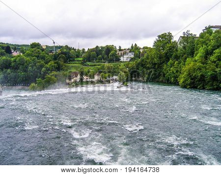 Rheinfalls Switzerland - August 9 2007: Rhine Falls with Castle Laufen during cloudy day