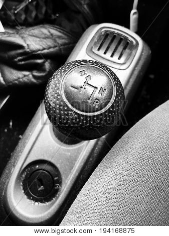 Black gearbox in semi auto car. Automotive black and white concept.