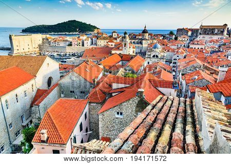 Dubrovnik Croatia. Sunset golden light over Old Town roofs of Ragusa. Adriatic Sea Mediterranean.