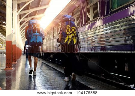 Young Couple lovers traveler in railway. Travel Concept.