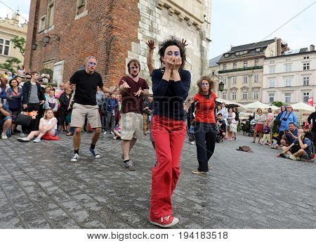 CRACOW POLAND - JULY 5 2017: 30th Street - International Festival of Street Theaters in Cracow Poland. An Odyssey Towards New Shores - a street parade