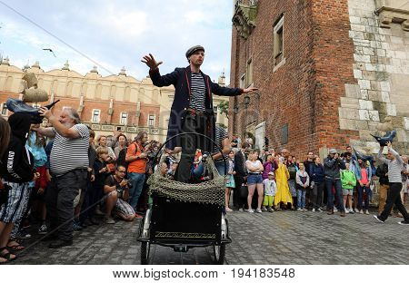 CRACOW POLAND - JULY 5 2017: 30th Street - International Festival of Street Theaters in Cracow Poland. An Odyssey Towards New Shores - a street parade