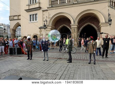CRACOW POLAND - JULY 5 2017: 30th Street - International Festival of Street Theaters in Cracow Poland. An Odyssey Towards New Shores - a street parade