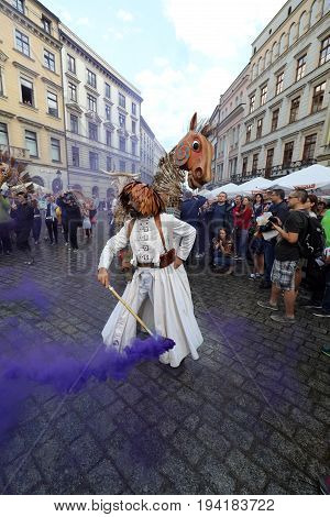 CRACOW POLAND - JULY 5 2017: 30th Street - International Festival of Street Theaters in Cracow Poland. An Odyssey Towards New Shores - a street parade