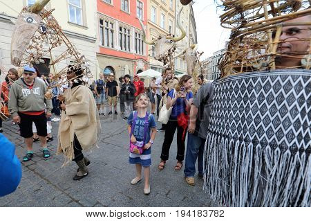 CRACOW POLAND - JULY 5 2017: 30th Street - International Festival of Street Theaters in Cracow Poland. An Odyssey Towards New Shores - a street parade