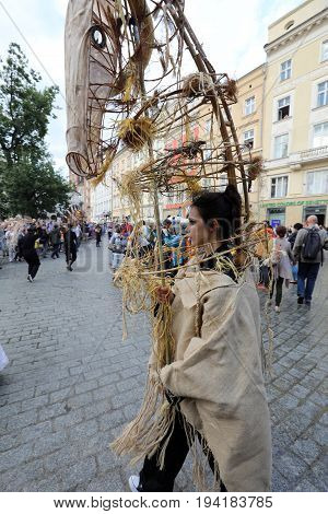 CRACOW POLAND - JULY 5 2017: 30th Street - International Festival of Street Theaters in Cracow Poland. An Odyssey Towards New Shores - a street parade