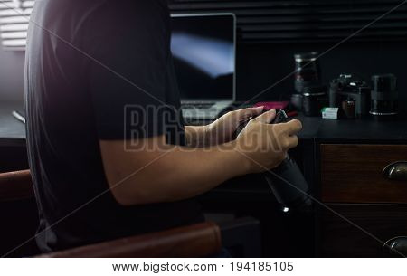 Photographer working checking photo Stylish home studio concept of hipster . Seleted focus.