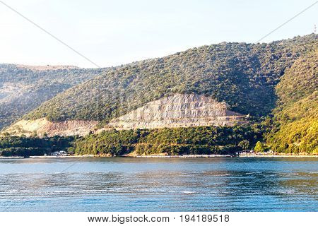 View from sea to Corfu island part and a port. Greece, sunset.