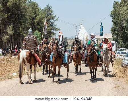 Tiberias Israel July 01 2017 : Participants in the reconstruction of Horns of Hattin battle in 1187 left the camp on horseback and ride go to the battle site near TIberias Israel