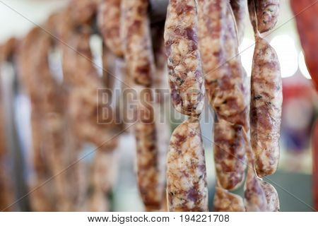 Strings of t raditional spanish hard cured sausage fuet