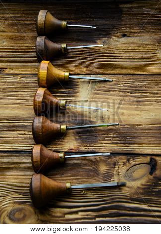 Different Gravers For Jewelry On Wooden Background