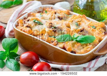Ziti bolognese in baking dish pasta casserole with minced meat tomato sauce and cheese horizontal