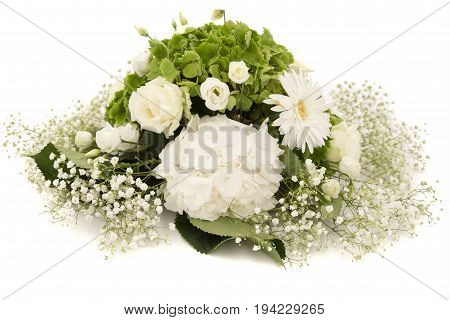 White and green Hydrangea flower Hortensia or Ortensia with white roses and gypsophila on white table. Weeding decoration ornaments