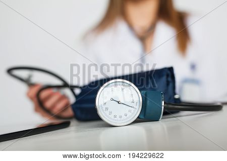 Close-up shot of pulsimeter and doctor on background.