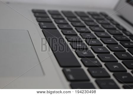 Laptop keyboard from another side, with a blur