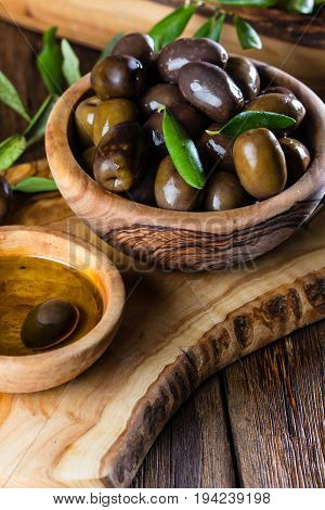 Olives And Olive Oil In Olive Wooden Bowls, Olive Tree Branch