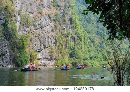 International Tourists Traveling On Local Vietnamese Small Boat