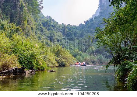 International Tourists Traveling On Local Vietnamese Small Boat
