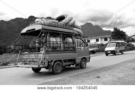 B-w Photo Of Adventure Traveller Car In Laos