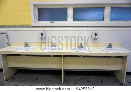 INDIAN RIVER, MICHIGAN / UNITED STATES - JUNE 18, 2017: Sinks are available for visitors to the Cross in the Woods Roman Catholic National Shrine.