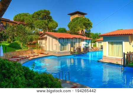 BELEK TURKEY SEP 9 2010: View on luxury swimming pool villas in hotel Paloma Grida Village & Spa for tourists in Italian style. Best Turkey holidays vacation tours travel. Italian style hotel