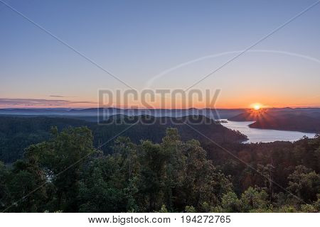 A bright sunrise over the mountains in HDR