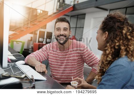 Start-up people working on desktop in co-working space